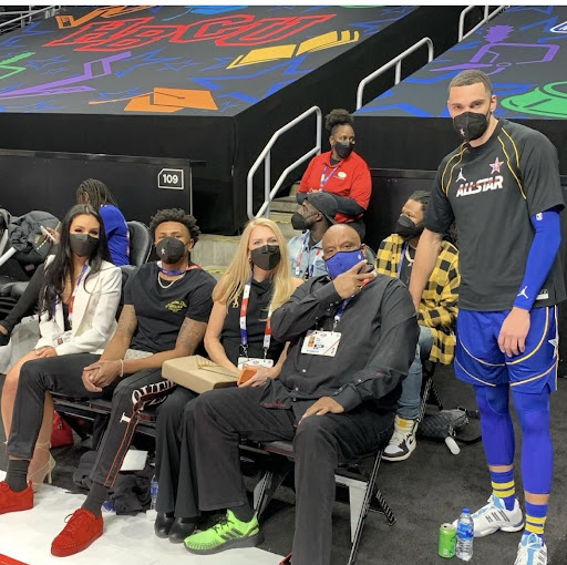 Zach Lavine, Paul Lavine, Perrion Callendret courtside at an NBA game